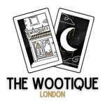 The Wootique London Logo two tarot cards one with an olde world shop